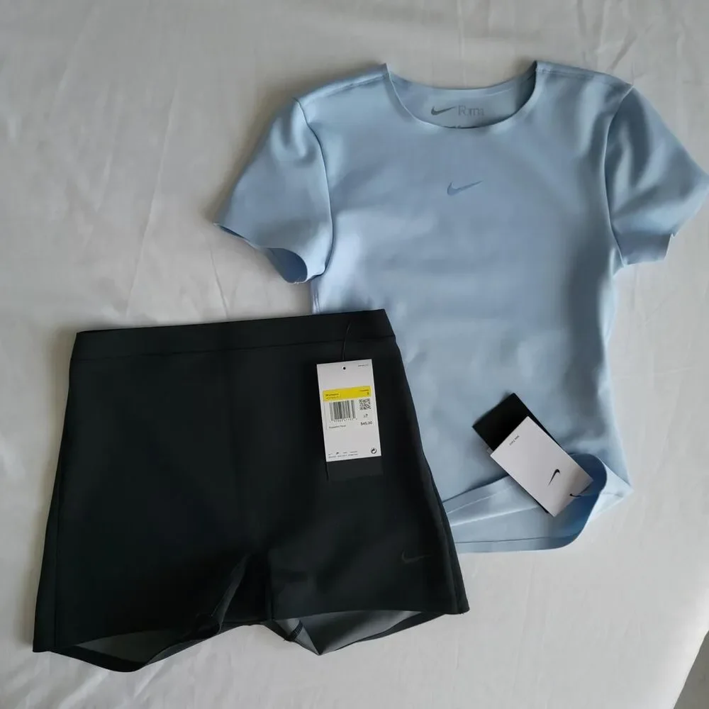 NWT NIKE FORM women's training top in baby blue, size xxs.